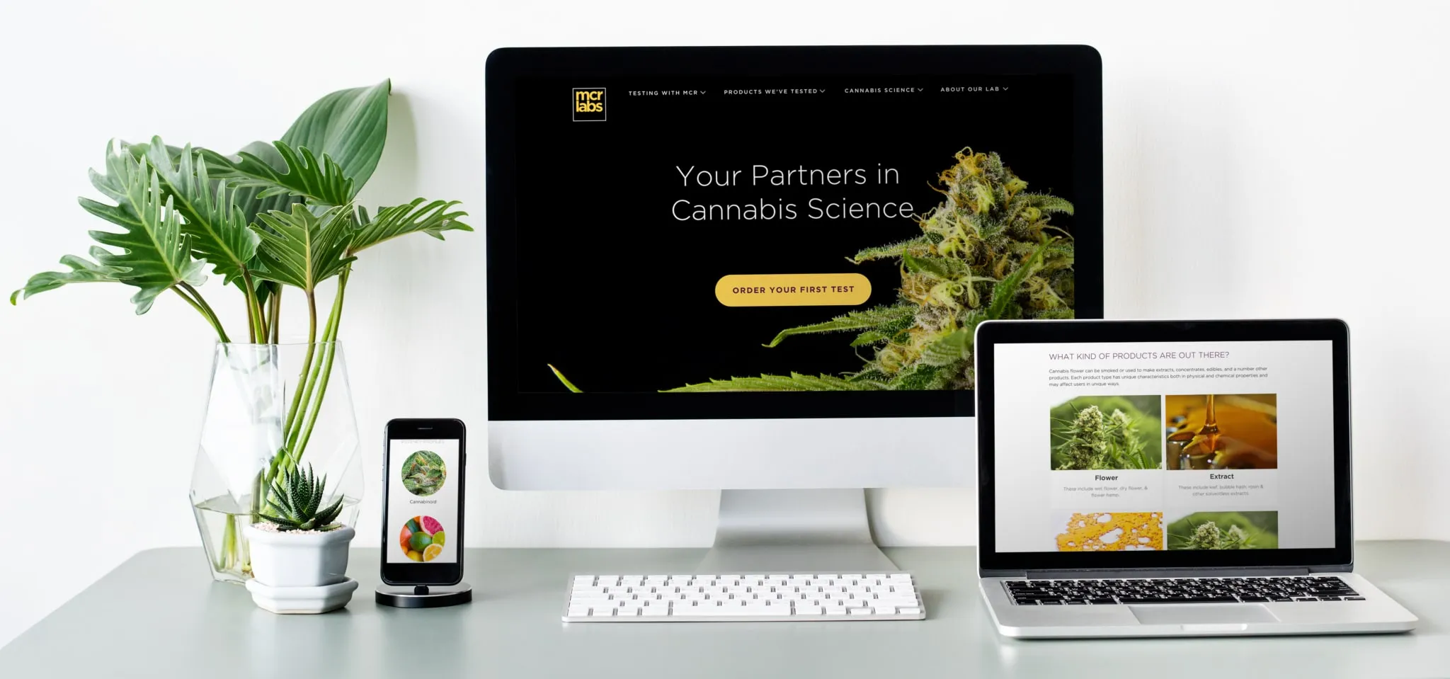 The redesigned MCR Labs site on a monitor, laptop and phone: Your Partners in Cannabis Science.
